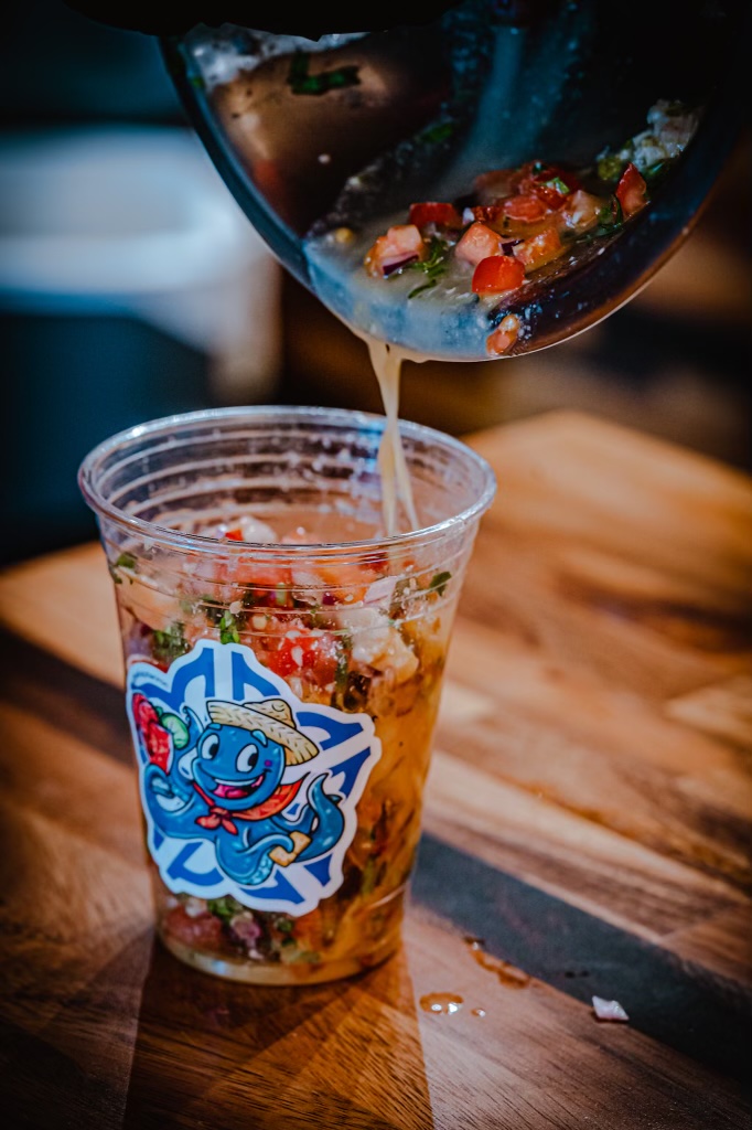 Ceviche being poured